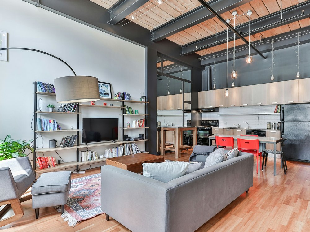 Open-concept hard loft with steel beam ceiling and industrial kitchen, Robert Watson Lofts, Roncesvalles