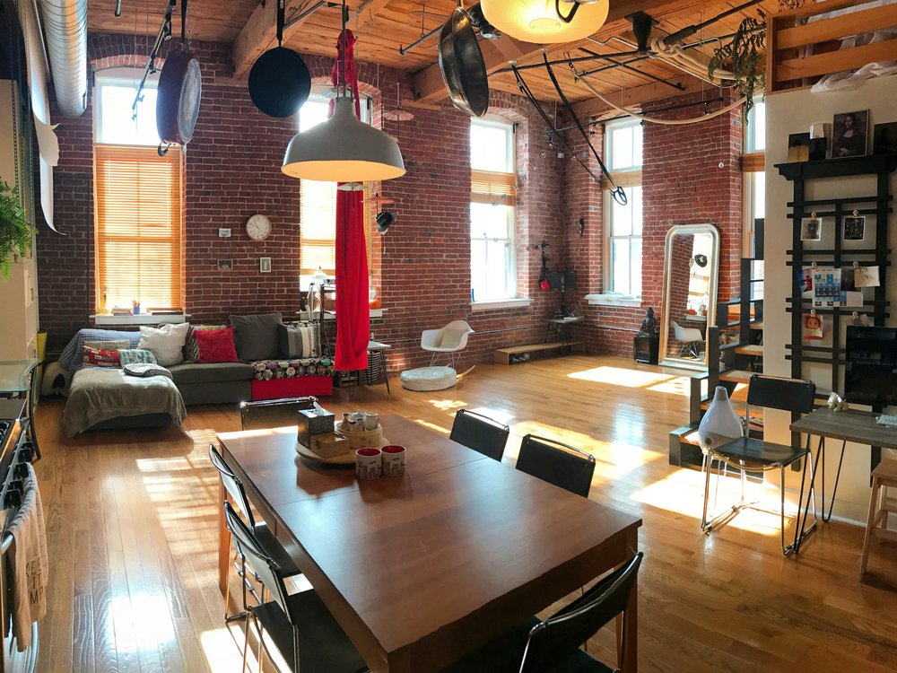 Sunlit hard loft with exposed red brick and timber ceiling, Toy Factory Lofts, Liberty Village